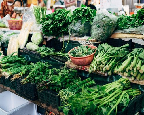 Fresh vegetables and herbs displayed in a Pakistani local market